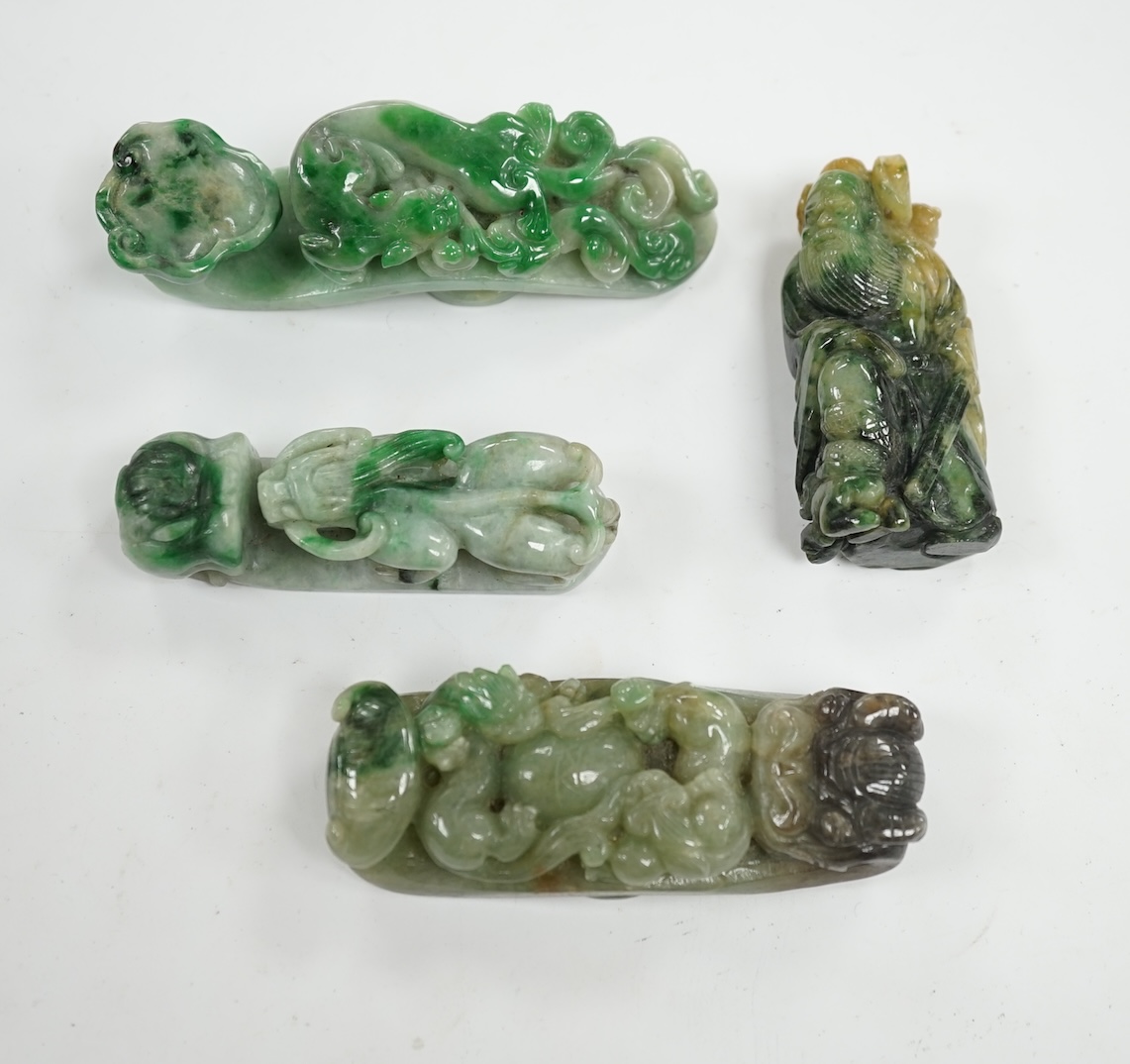 Four Chinese green bowenite jade carvings and belt hooks, largest 9.5cm in length. Condition - good